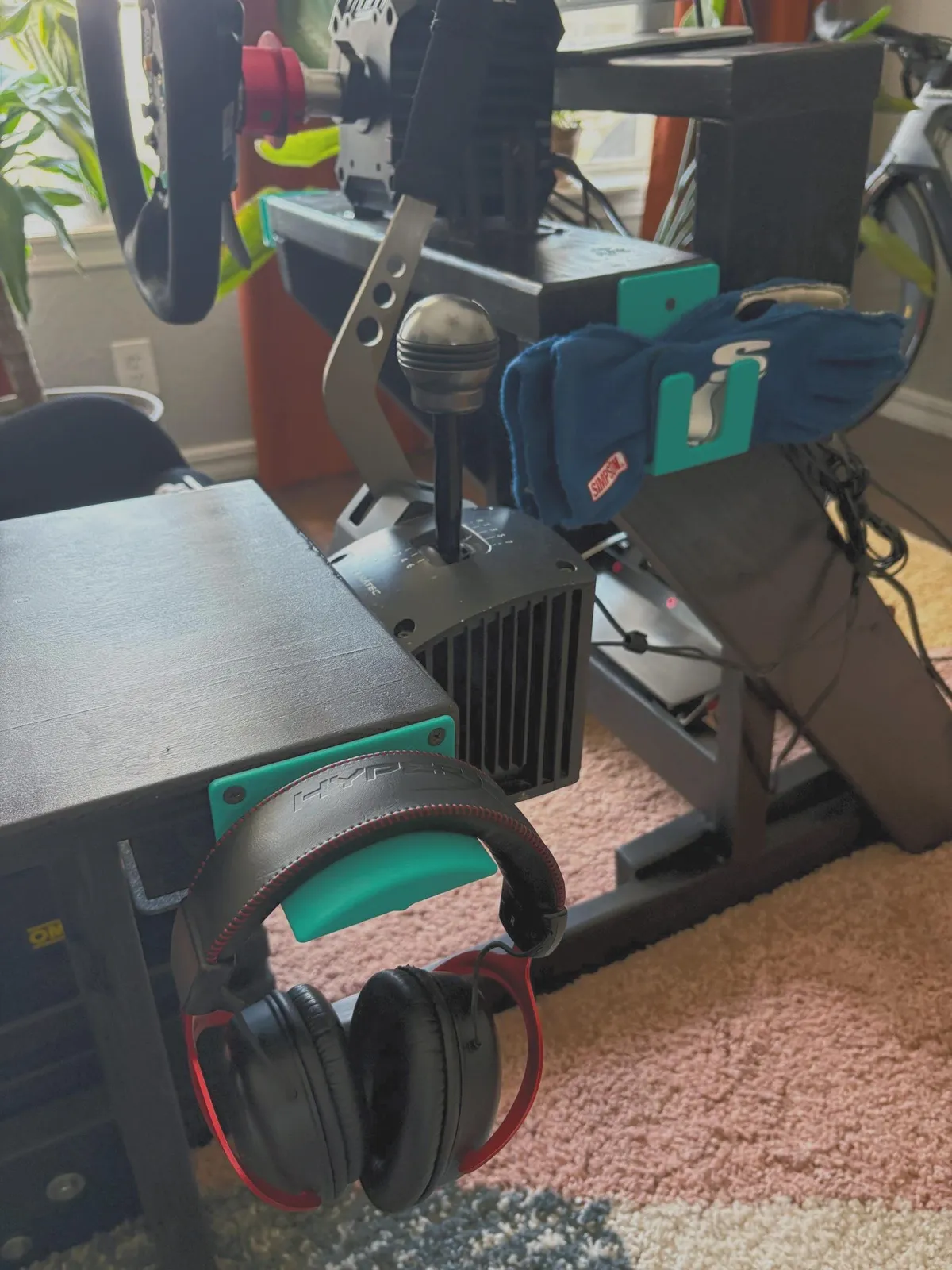 ASA-printed sim racing headphone and glove hook mounted on a rig